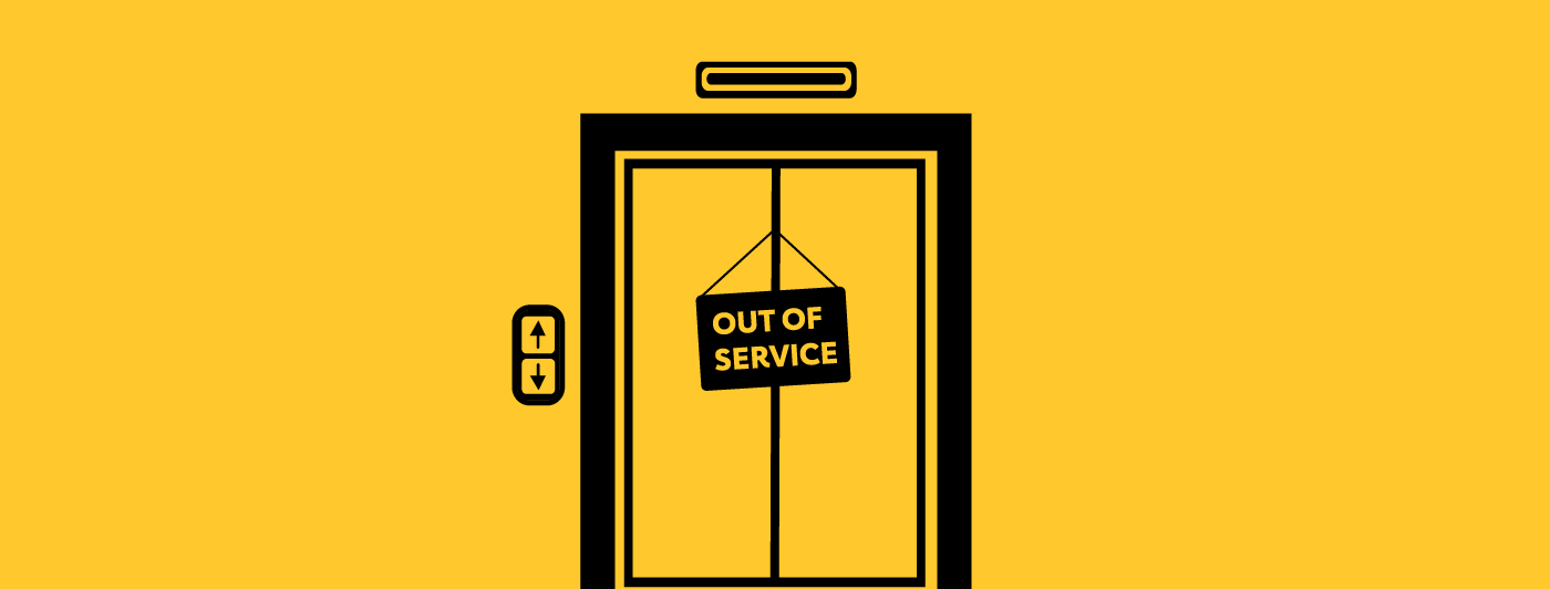 An elevators with a sign that reads "Out of Order"